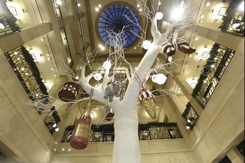 The major festive feature is a white tree from which internally lit baubles and a giant bottle of champagne are suspended.